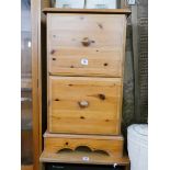 A pine two drawer office filing cabinet