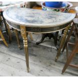 A gold and black lacquered semi-circular console table on reeded style legs 2'6 wide