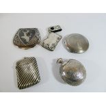 A collection of five white metal and plated Vesta cases,