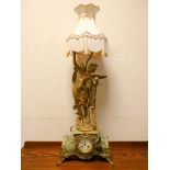 A French striking mantel clock in green onyx and gilt mounted case with large gilt angel figure