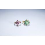 Two 9ct gold ladies dress rings one set with emeralds the other with rubies,