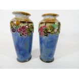 A pair of Royal Doulton stoneware vases numbered 9384 on the base,