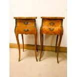 A pair of French floral inlaid Kingwood bedside cabinets each fitted two drawers standing on