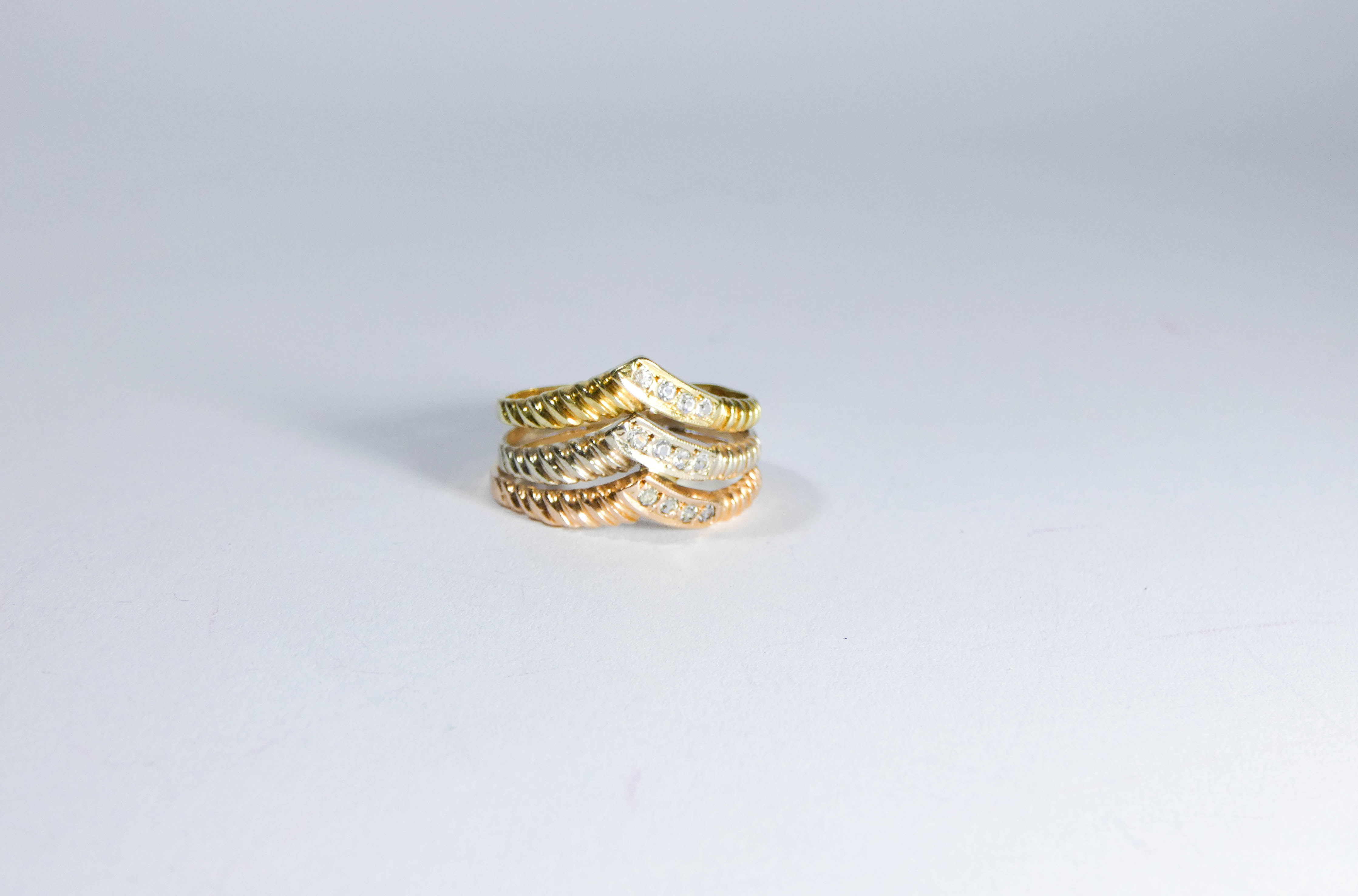 Middle Eastern tri-colour gold wishbone dress ring, set with white stones,