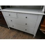 A modern cream painted chest of two long and two short drawers matching the previous dressing table