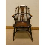 An oak Windsor stick back hooped elbow chair on Crinoline style base