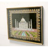 A fine needlework picture of the Taj Mahal in a gilt frame,