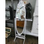 A cheval oval mirror in decorative white frame