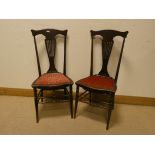 A pair of Edwardian bedroom chairs with upholstered seats