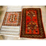 A red and patterned Persian prayer mat