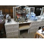 A GPlan limed oak finished knee hole dressing table with triple mirrors and matching stool,