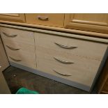 A modern light beech long low chest fitted six drawers with stainless steel handles 5'6 wide