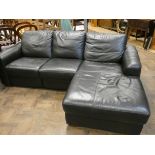 A modern low backed corner settee unit in black leather