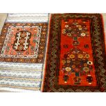 A red and floral patterned Persian rug