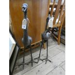 A pair of bronze effect crane garden ornaments