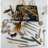 A collection of button hooks, costume jewellery,