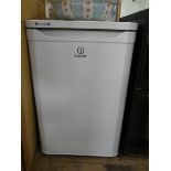 An Indesit worktop height fridge