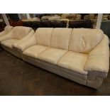 A three piece lounge suite in cream leather comprising three seater settee,