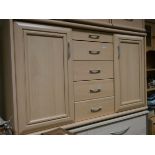 A modern light beech sideboard fitted five centre drawers and cupboards 4'6 wide