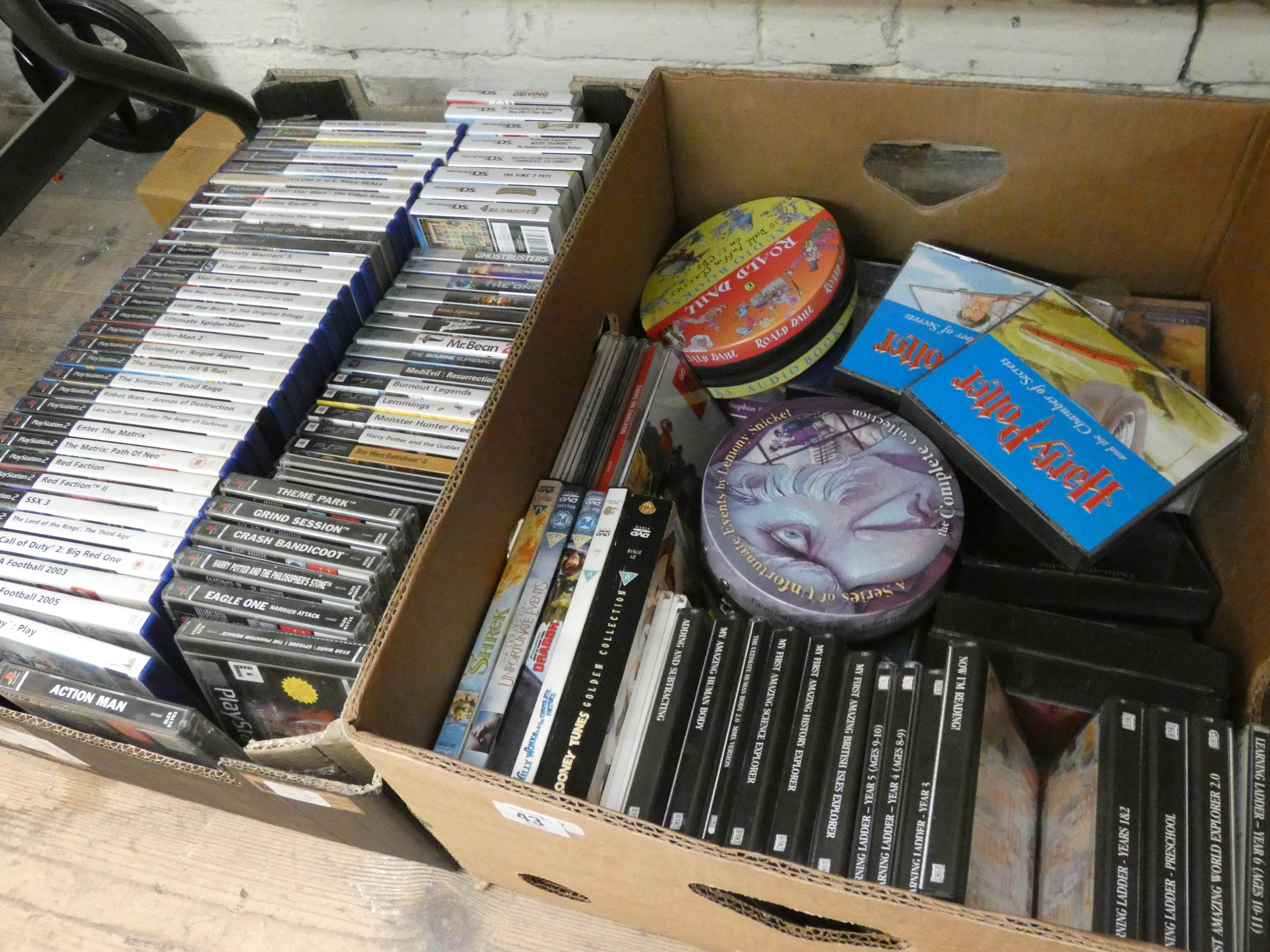 Two large boxes of Playstation 2 games, PSP games, Now I am Reading educational games,