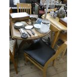 A modern pine drop leaf kitchen table and a pair of beech slat back dining room chairs