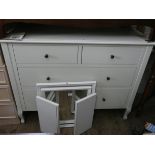 A modern white chest of two long and two short drawers,