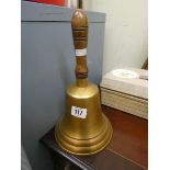 A large brass school bell