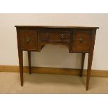 A Georgian style bow front mahogany sideboard fitted drawer and cupboards on square taper legs 3'6