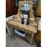 A Victorian style stripped pine dressing table fitted under tier with toilet mirror back,