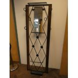 A modern metal framed hall stand fitted with mirror,