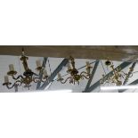 A pair of five branch brass electric light pendants and another similar