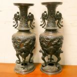 A pair of dragon decorated Chinese vases, 15.