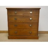 An Edwardian ash chest of three long and two short drawers,