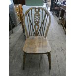 A pair of wheel back Windsor dining chairs