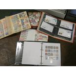 A collection of USA loose stamps and four albums of world stamps