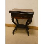 A mahogany folding top card table fitted drawer with a shelf under on four shaped legs 22" wide