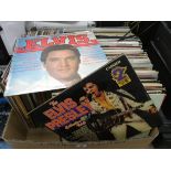 A large box of vinyl LP records,