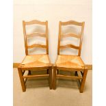 A set of six French style light oak ladder back dining chairs with rushed seats