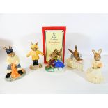 A group of five Royal Doulton Bunnykins figures: Rainy Days, New Baby, Fisherman Bunny,