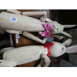 Two large wooden jointed rabbits