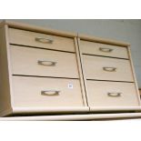 A pair of light beech three drawer bedside chests matching the previous lot