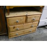 A low modern pine chest of two long and two short drawers,