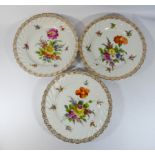 Three Dresden cabinet plates painted with floral sprays 22cms diameter