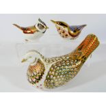 A collection of three Royal Crown Derby bird paperweights to include a Dove and Collectors Guild
