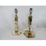 A pair of hallmarked silver octagonal based candlestick lamp stands converted to electricity,