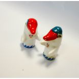 A collection of Fina Petrol Porcelain giveaway penguin figurines