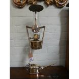 A wall fixing brass oil lamp and an old polished brass oil can