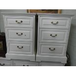 A pair of modern white three drawer bedside chests,