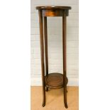 A two tier circular inlaid mahogany plant pedestal