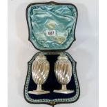 A pair of 19th century cased salt and pepper pots, Neo classical urn shape,